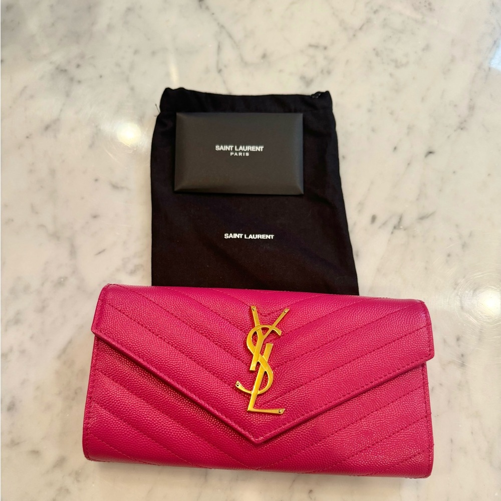 Saint Laurent Cassandre Matelasse large flap leather wallet in fuschia